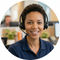 Person wearing a ProKlinSupply shirt with a headset in an office setting
