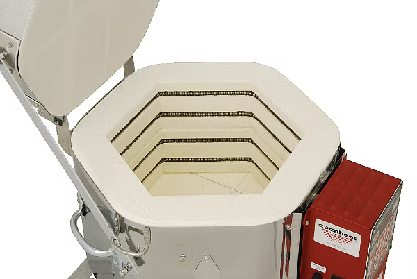 A white ceramic or stone hot air oven with its lid open, showing the interior heating elements, alongside a red control box with a visible 'WeatherTech' brand label.